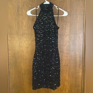 high neck black sequined dress with low back